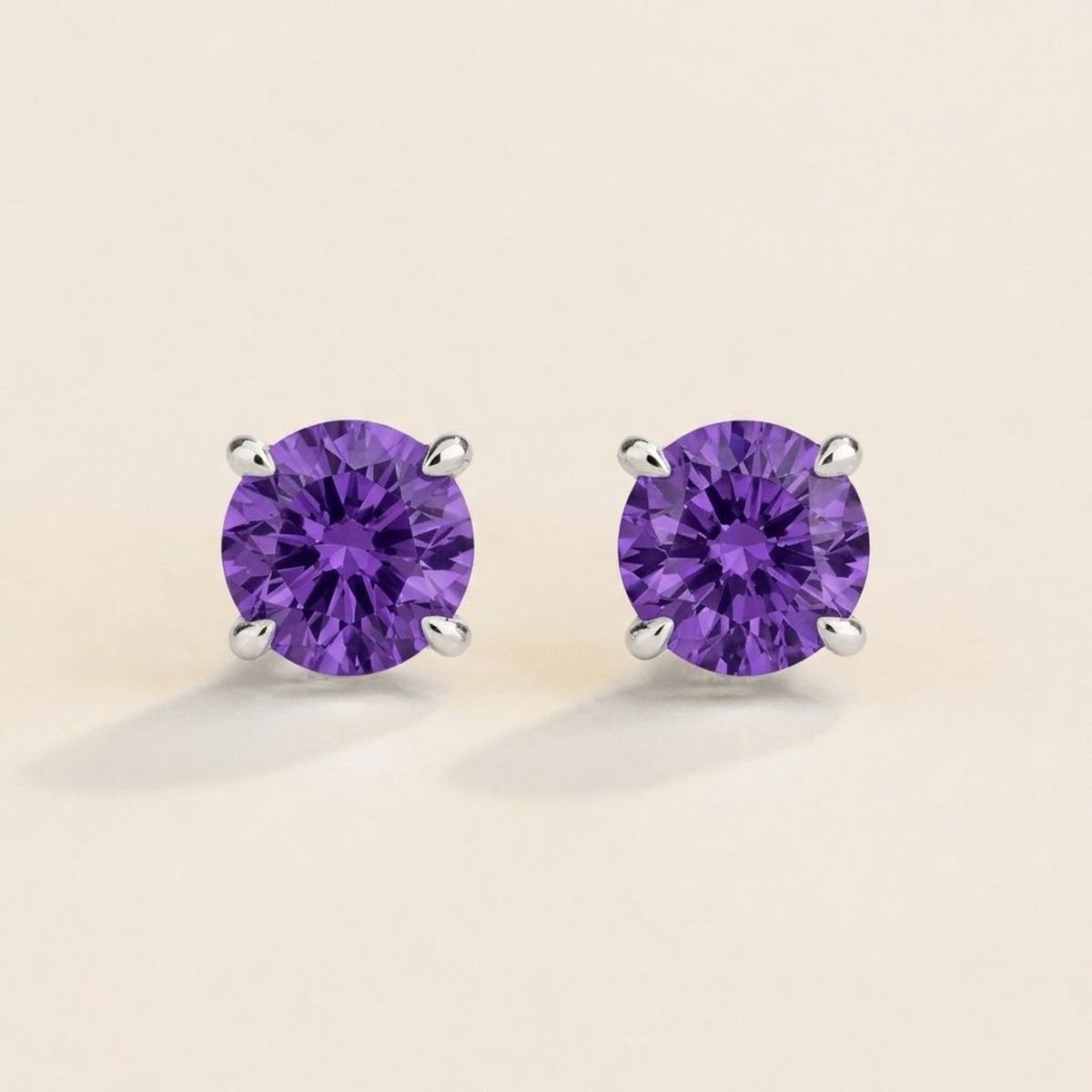 Nina round lab-grown purple sapphire solitaire stud earrings in white gold – front view | Juvetti London