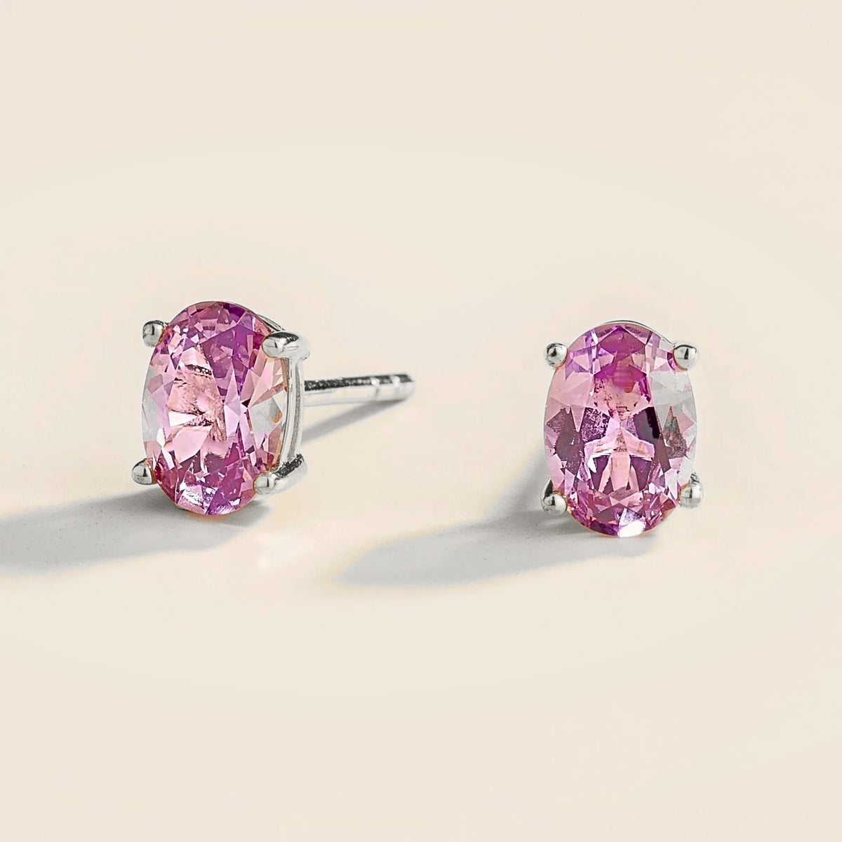 Oval purple sapphire solitaire stud white gold earrings