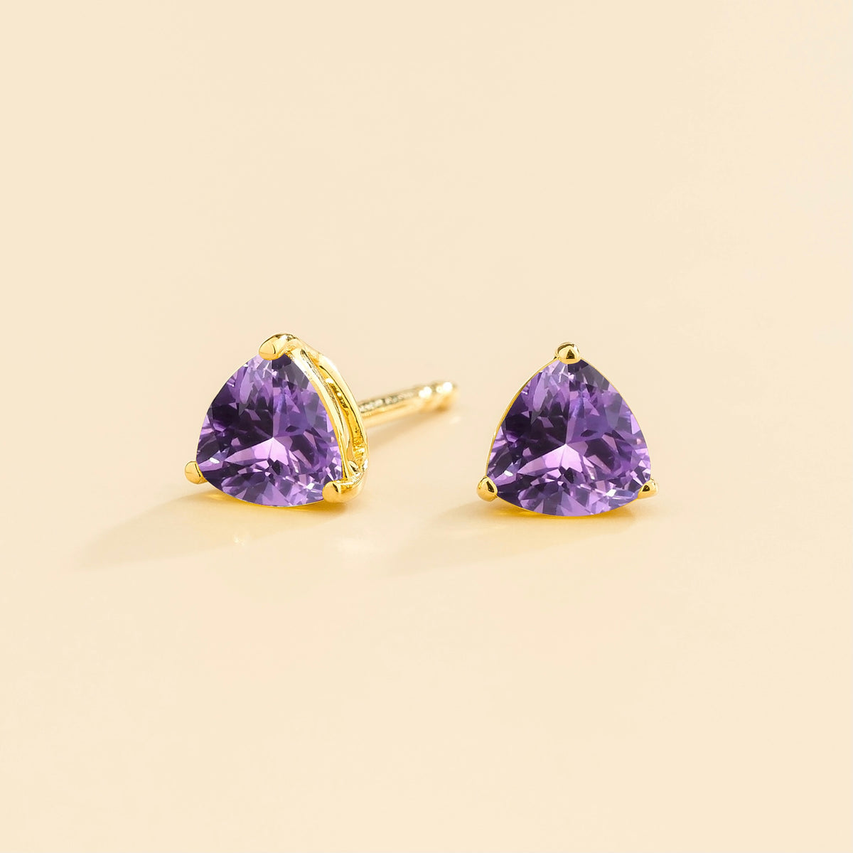 Trillion Purple Sapphire Solitaire Stud Earrings in Gold – angle view