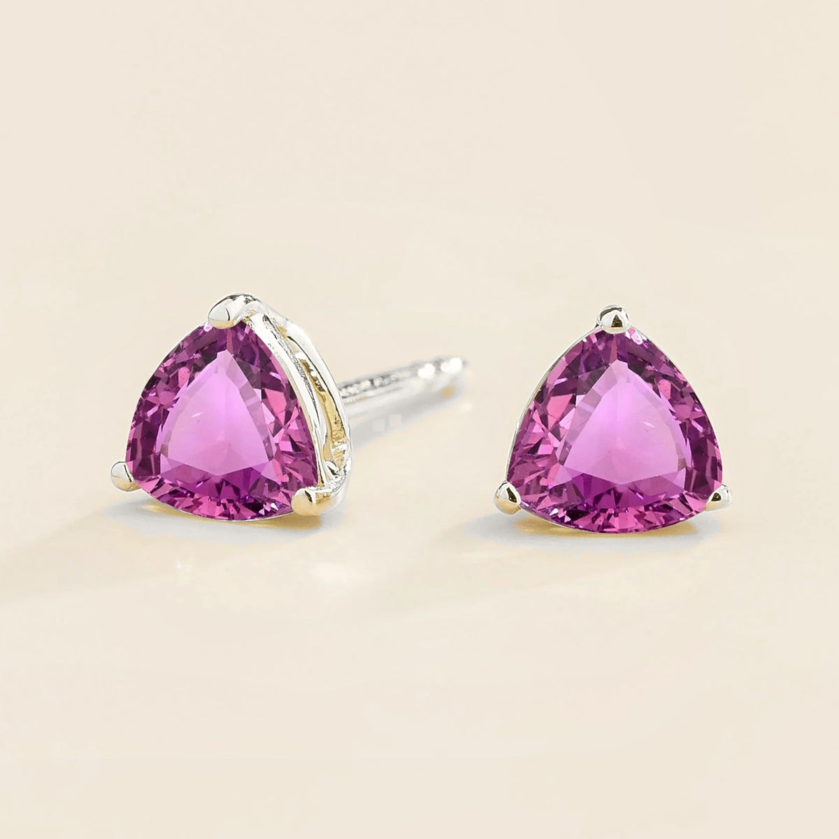 Trillion Purple Sapphire Solitaire Stud Earrings in White Gold – angle view