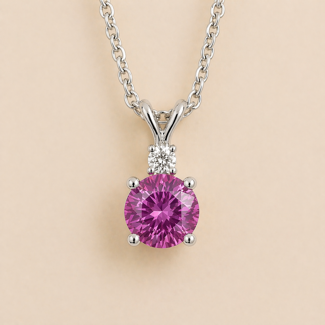Front view of the Joie Round Purple Sapphire & Diamond Drop Pendant Necklace In White Gold, handcrafted by Juvetti London
