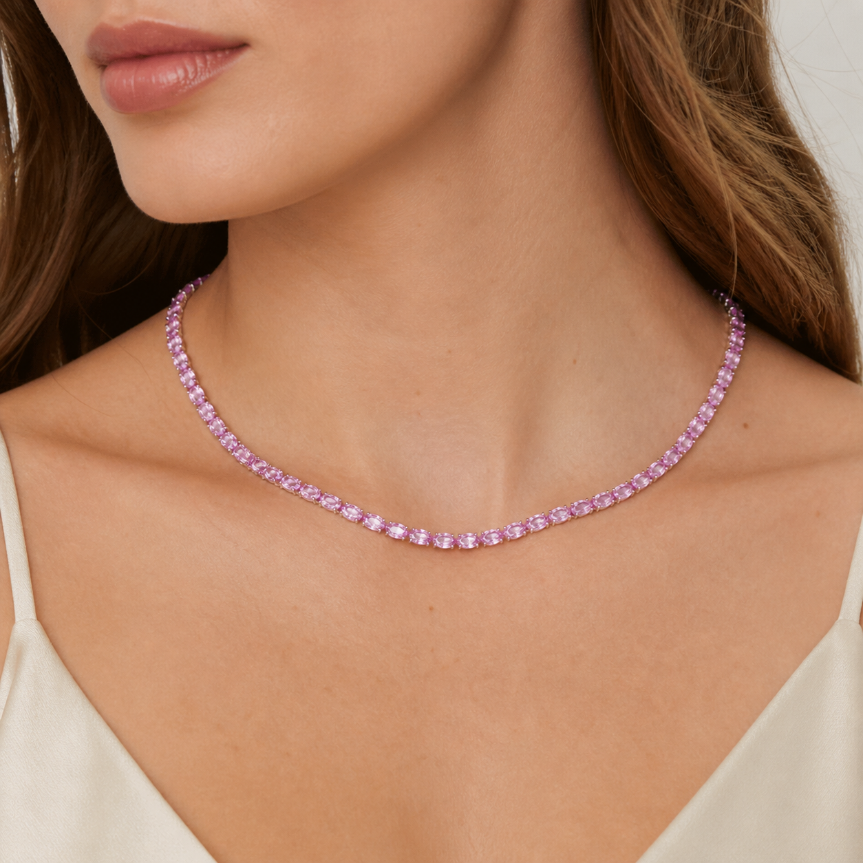 Model wears the Salto oval purple sapphire pendant necklace in gold