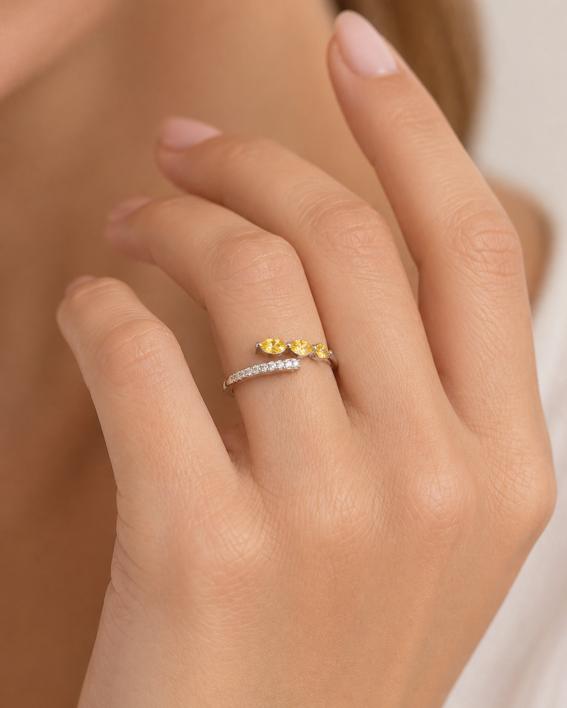 Model wearing the Sava Purple Sapphire Three-Stone & Diamond Pavé Ring in Gold