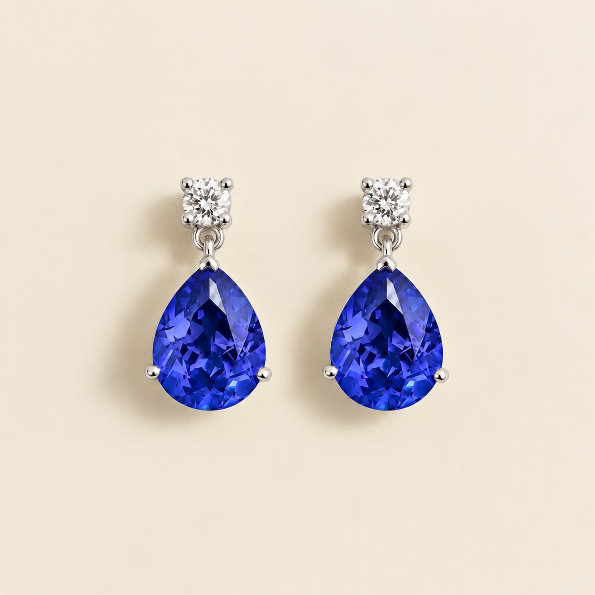Medium lab-grown royal blue sapphire and diamond pear drop earrings in white gold – front view | Pisa by Juvetti