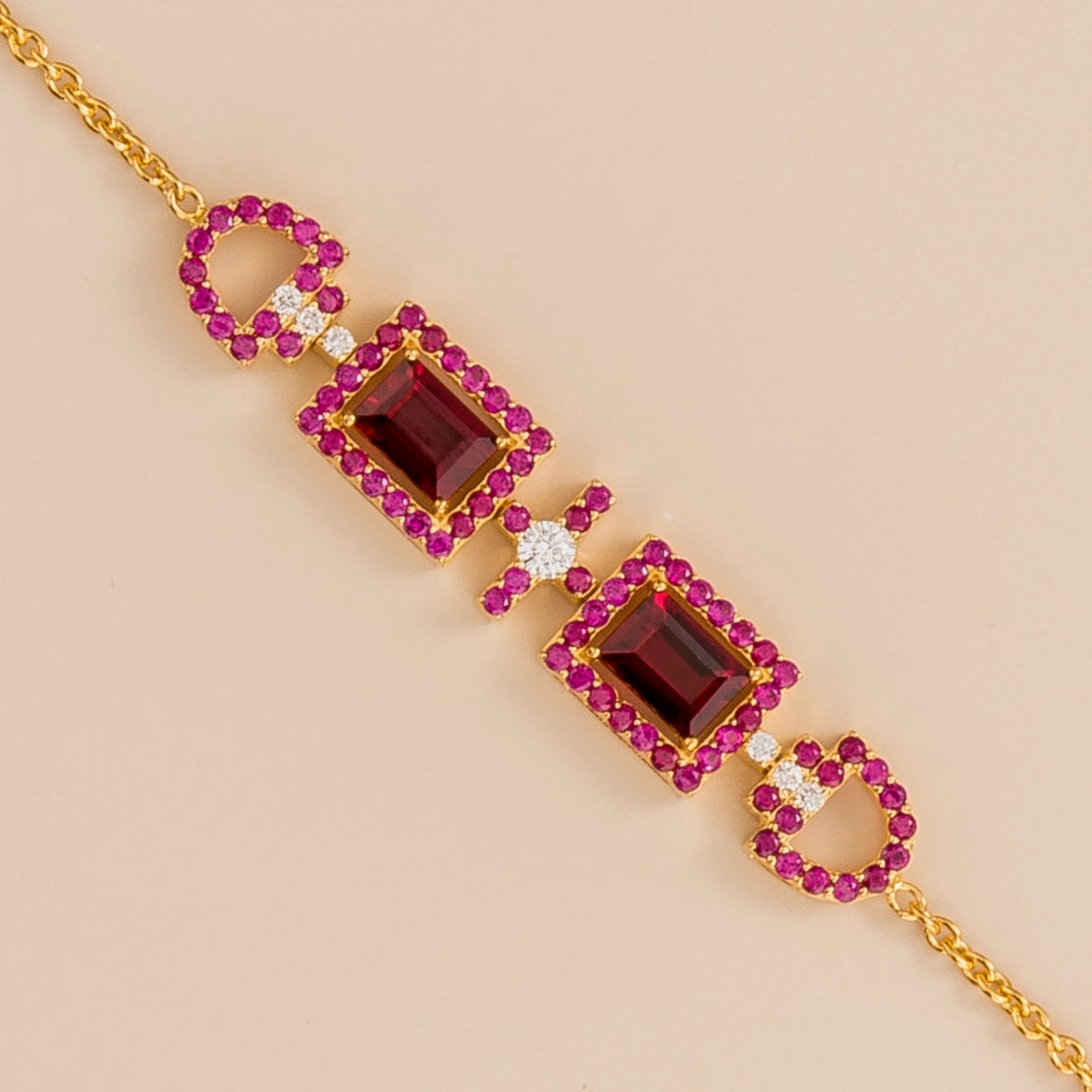 Ciceris ruby Art Deco halo bracelet in gold, two emerald-cut lab-grown rubies with diamonds, close-up | Juvetti London