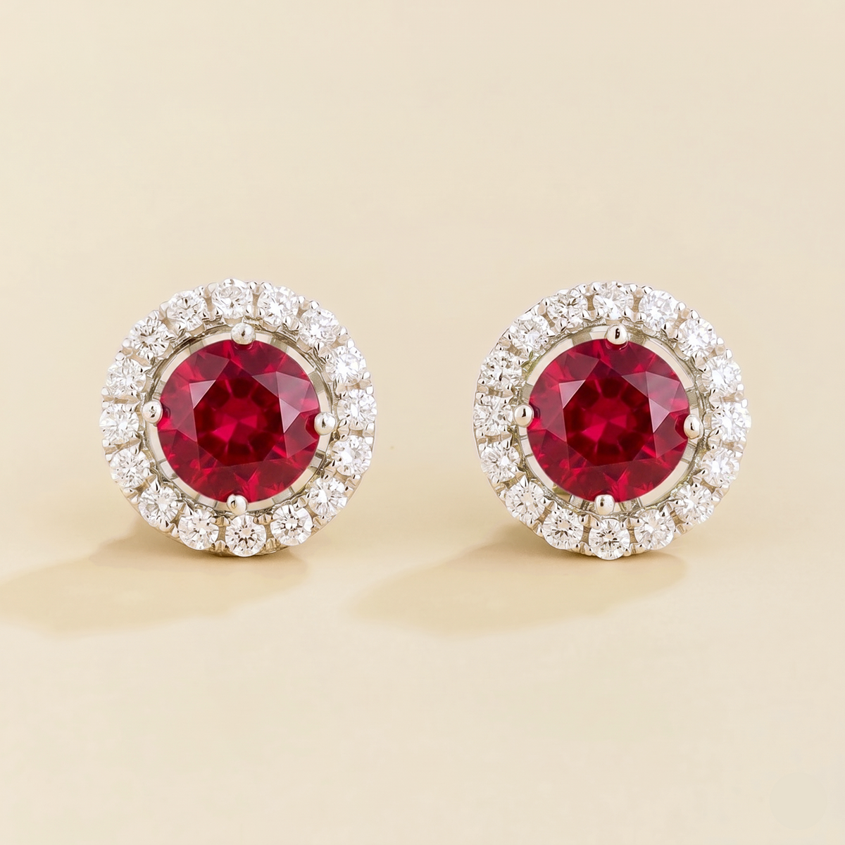 Floret round lab-grown ruby and diamond halo stud earrings in white gold – front | Juvetti London