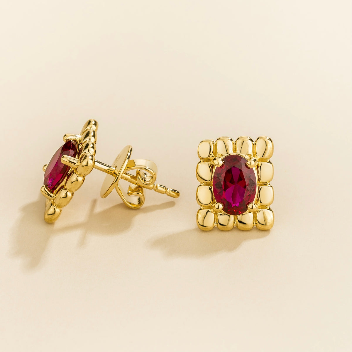 Fondi oval lab-grown ruby sculpted stud earrings in gold – side view | Juvetti London