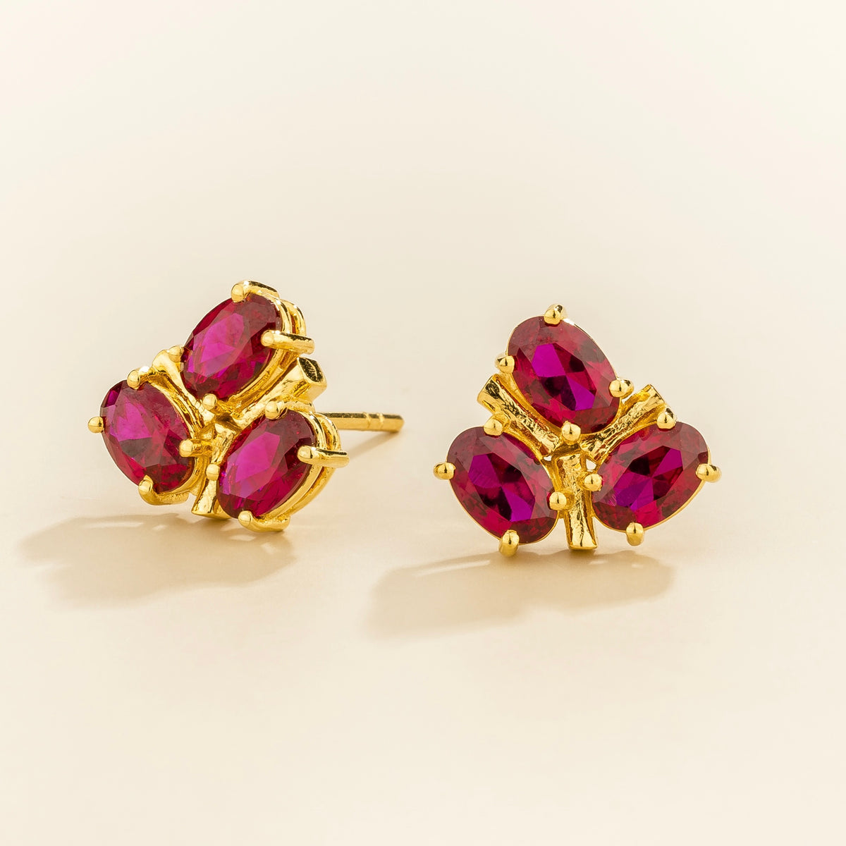 Ligna oval ruby cluster stud earrings in gold – angle view
