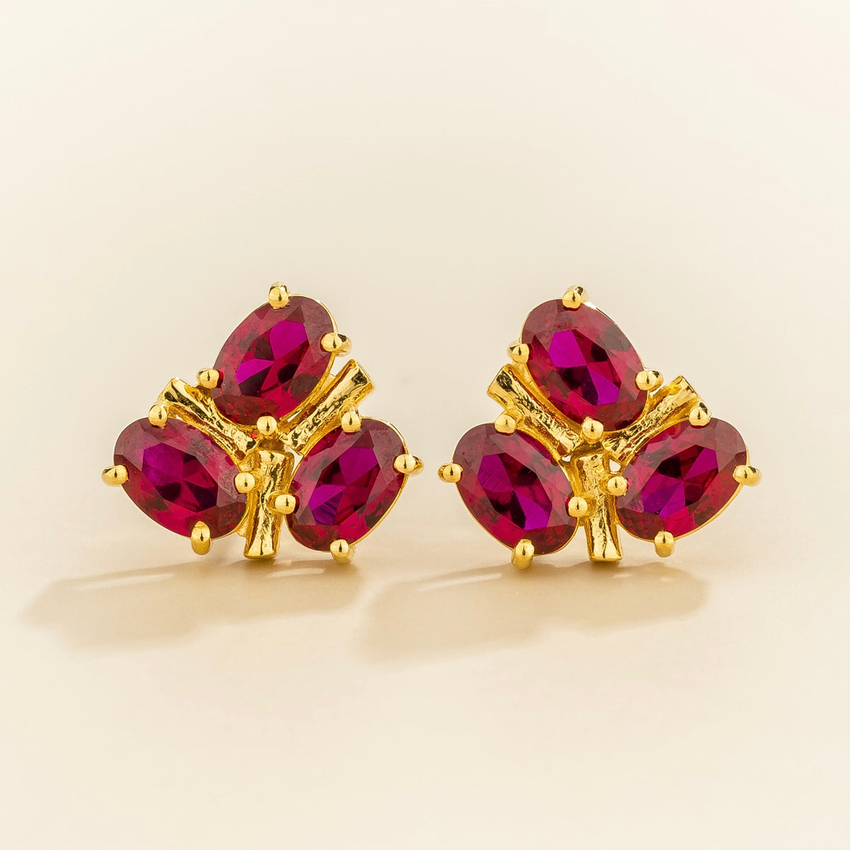 Ligna oval lab-grown ruby cluster stud earrings in gold | Juvetti London