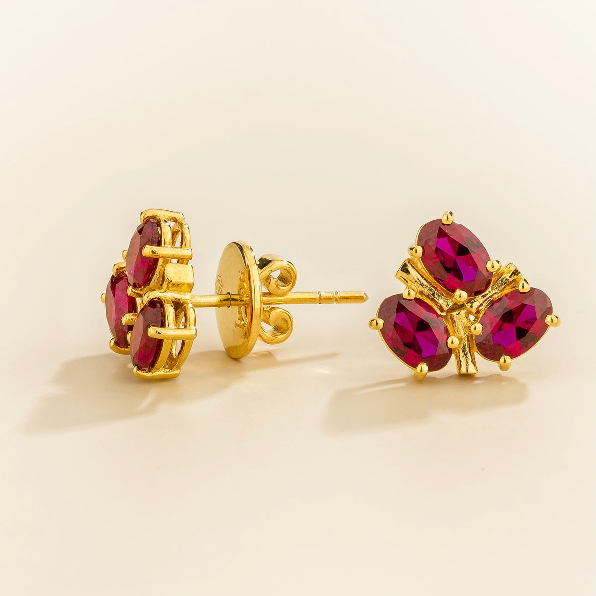 Ligna oval ruby cluster stud earrings in gold – side view