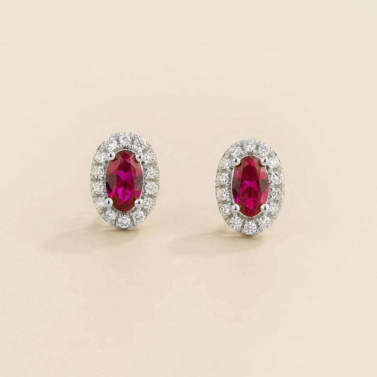 Mini lab-grown ruby and diamond oval halo stud earrings in white gold – front view | Mina by Juvetti