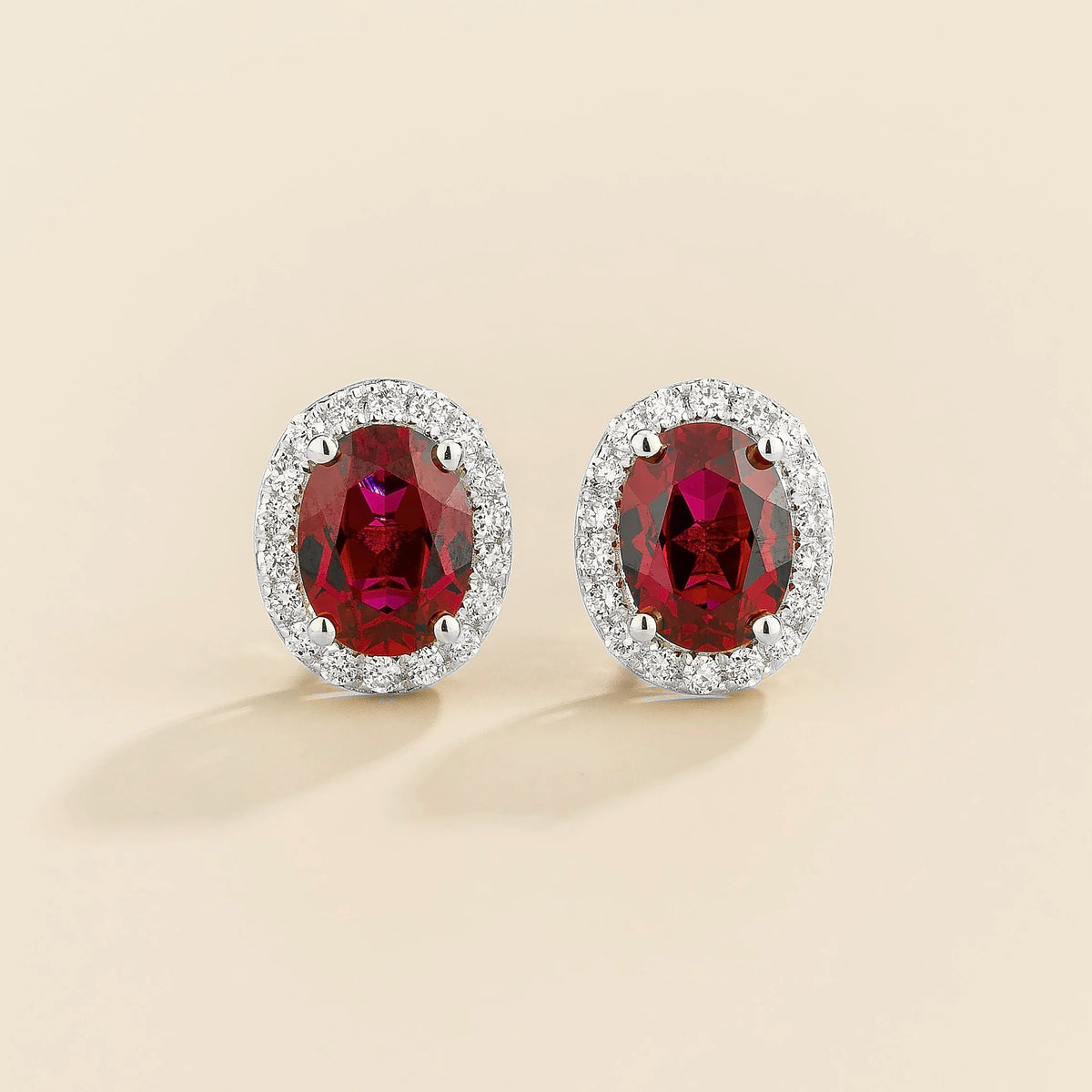 Lab-grown ruby and diamond oval halo stud earrings in white gold – front view | Mina by Juvetti