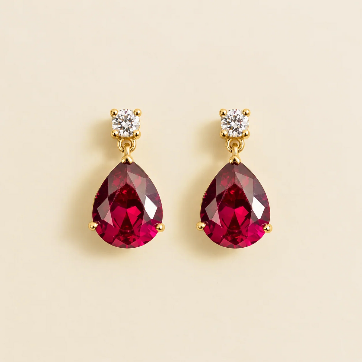Medium lab-grown ruby and diamond pear drop earrings in gold – front view | Pisa by Juvetti
