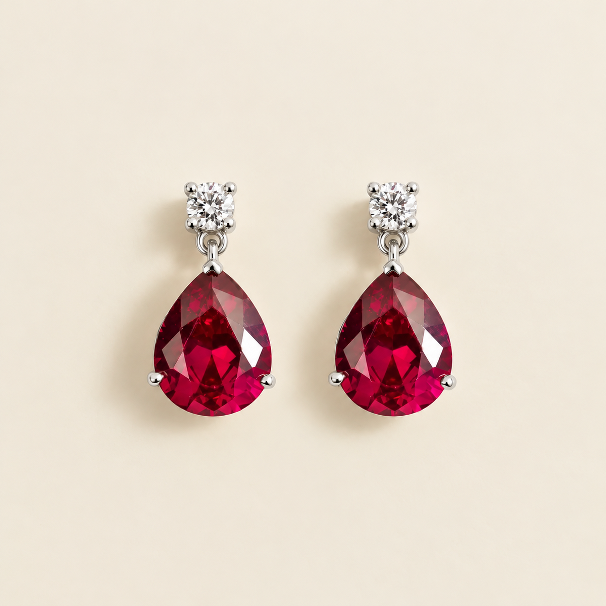 Medium lab-grown ruby and diamond pear drop earrings in white gold – front view | Pisa by Juvetti