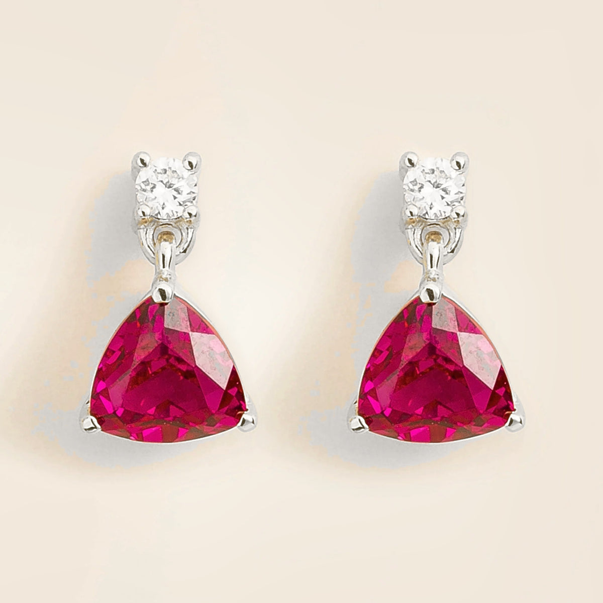 Trillion ruby & diamond drop earrings in white gold