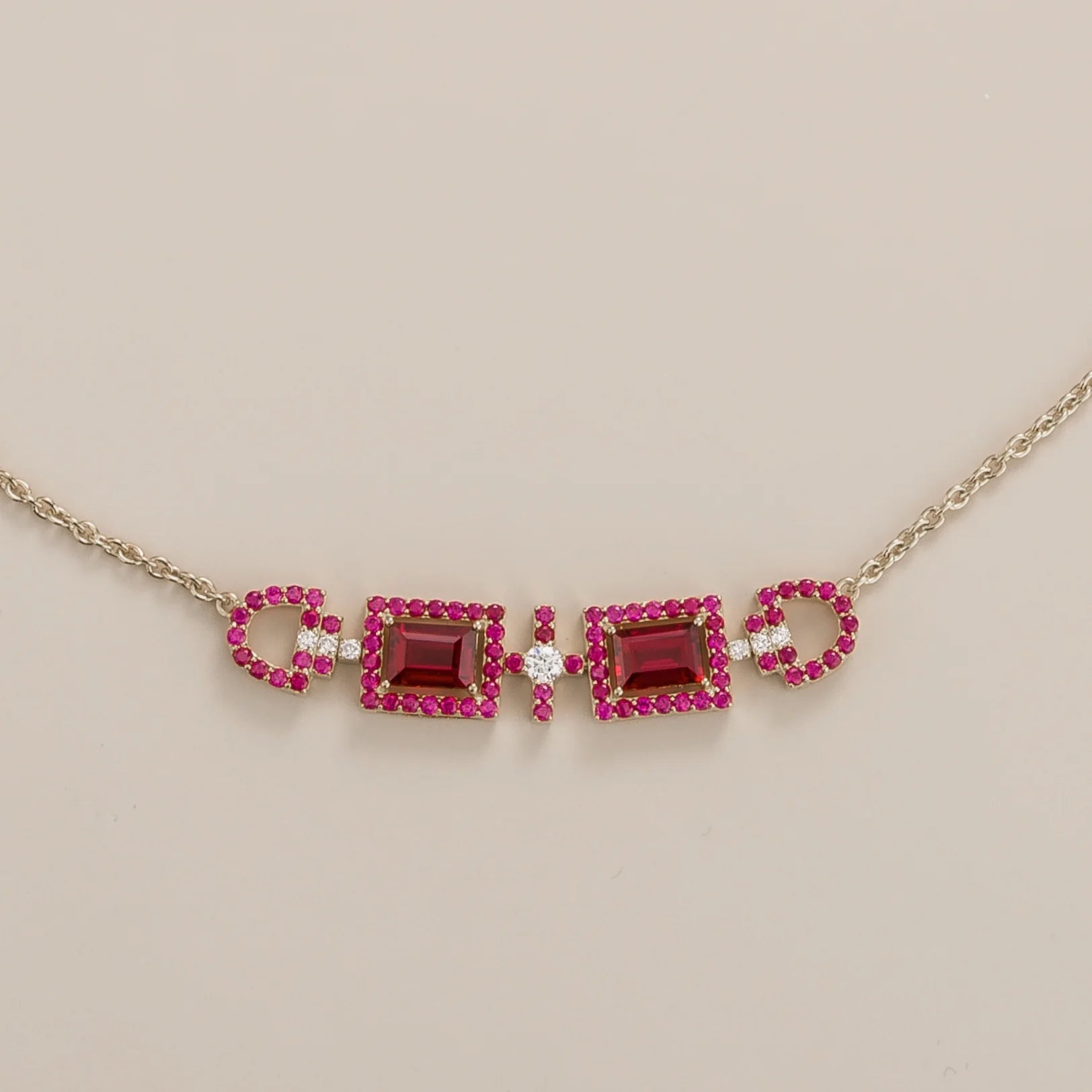 Front view of the Ciceris Ruby & Diamond Rectangle Halo Statement White Gold Necklace, handcrafted by Juvetti London
