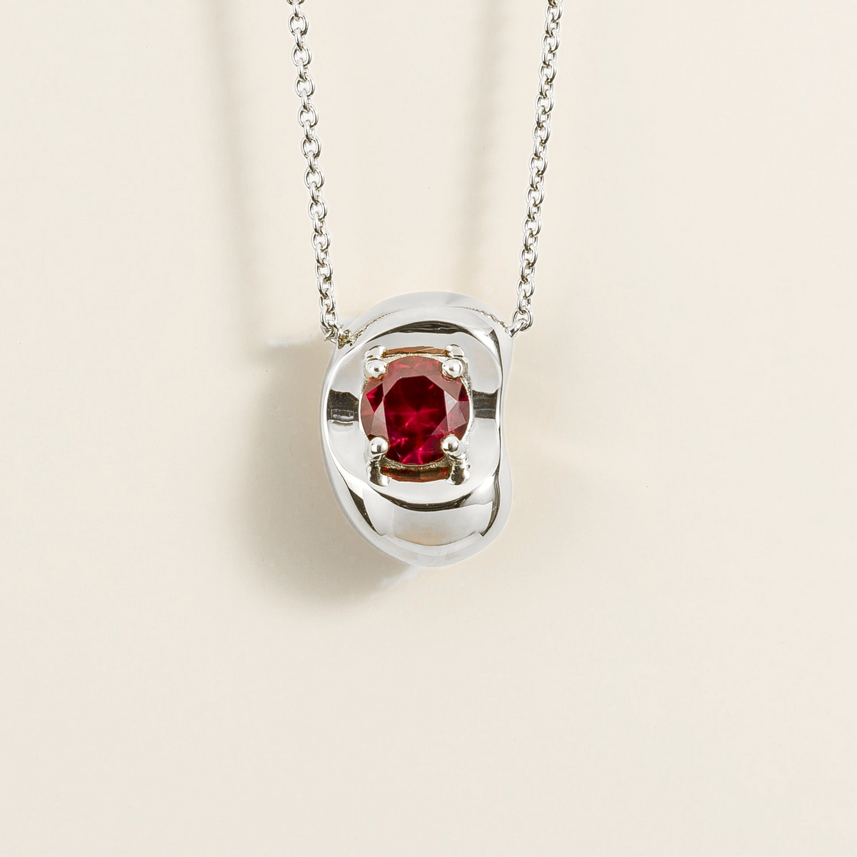 Fava Round Ruby Oval Solitaire Pendant Necklace in White Gold by Juvetti, bespoke jewellery London