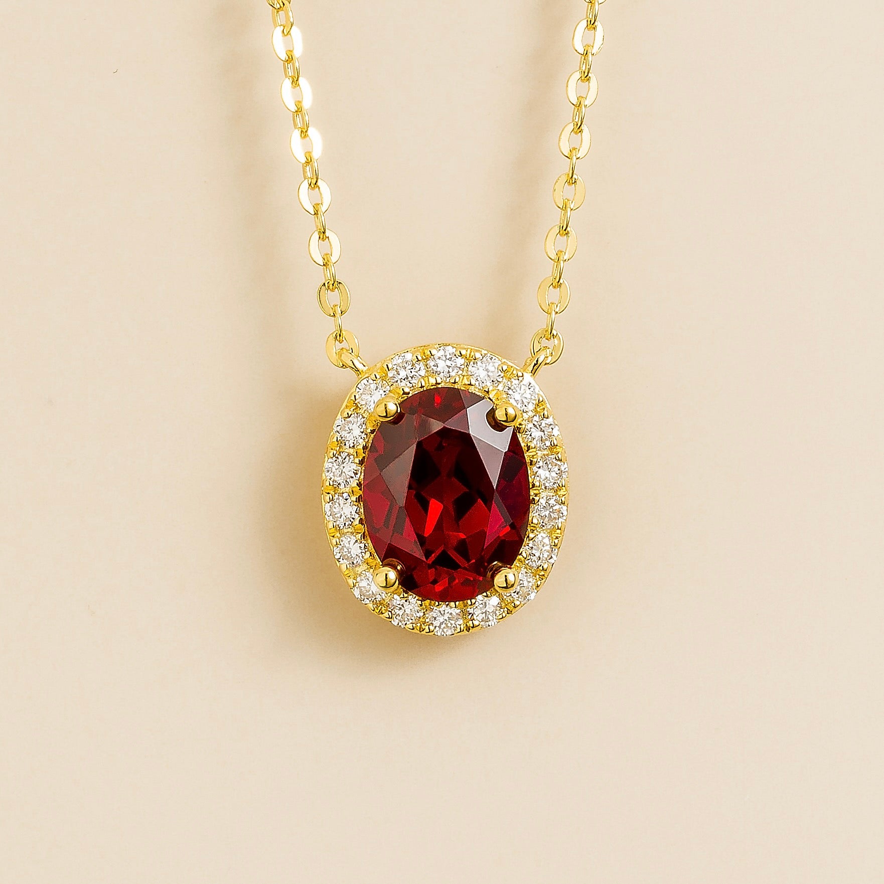 Mina Oval Ruby & Diamond Halo Necklace In Gold by Juvetti, bespoke jewellery London
