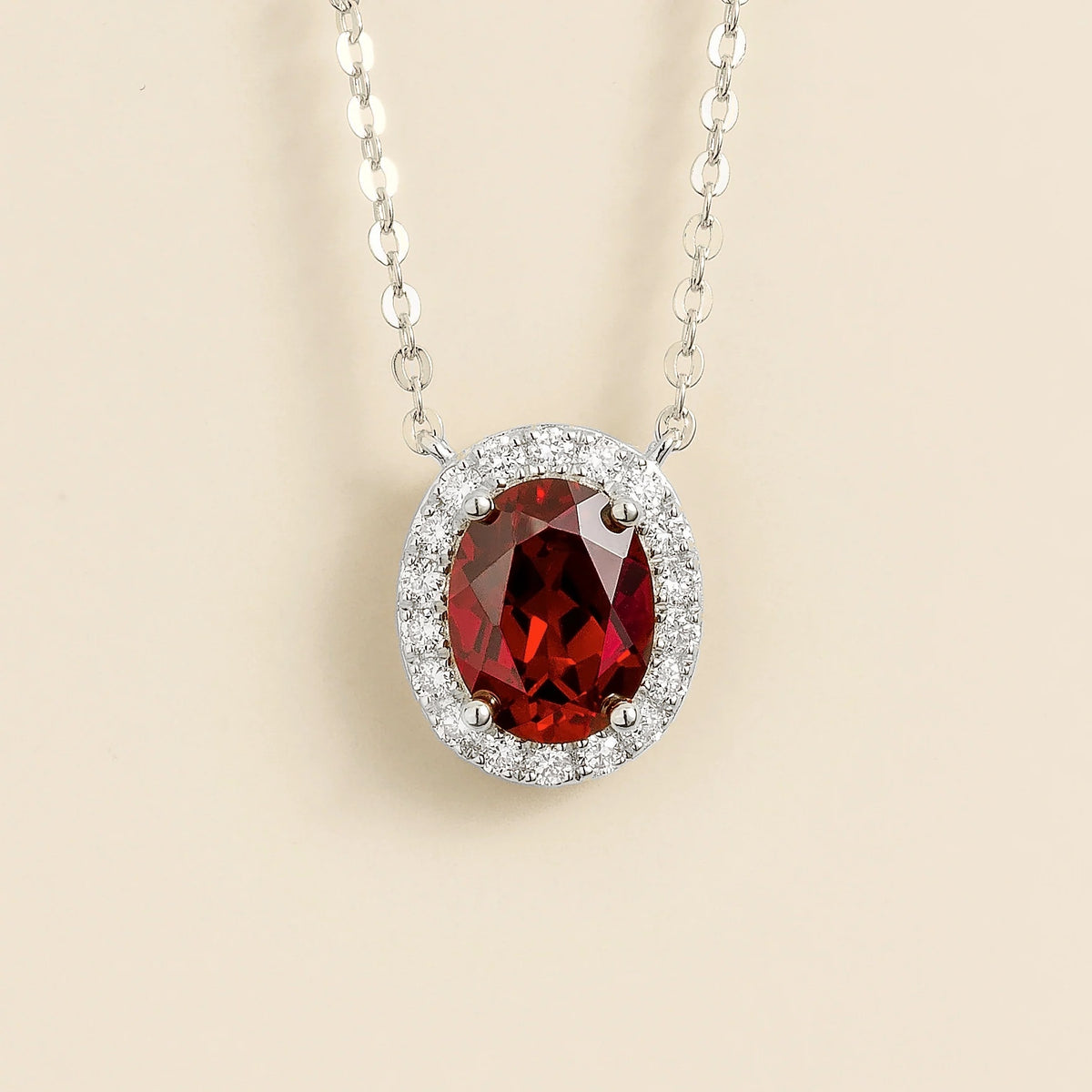 Lab-grown ruby and diamond oval halo necklace in white gold – front view | Mina by Juvetti