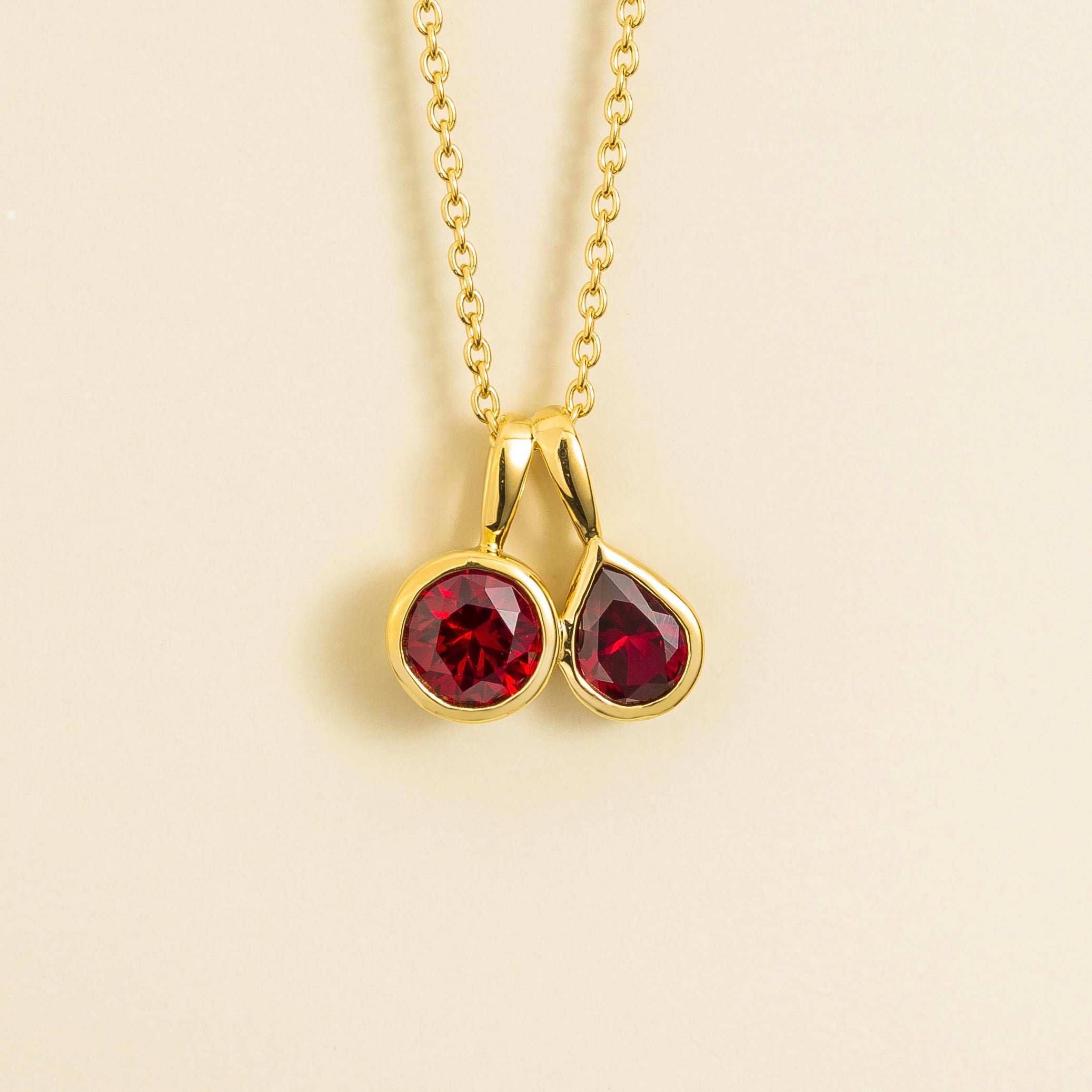 Prunus Ruby Round & Pear Cut Bezel Set Two-Stone Pendant Gold Necklace by Juvetti London