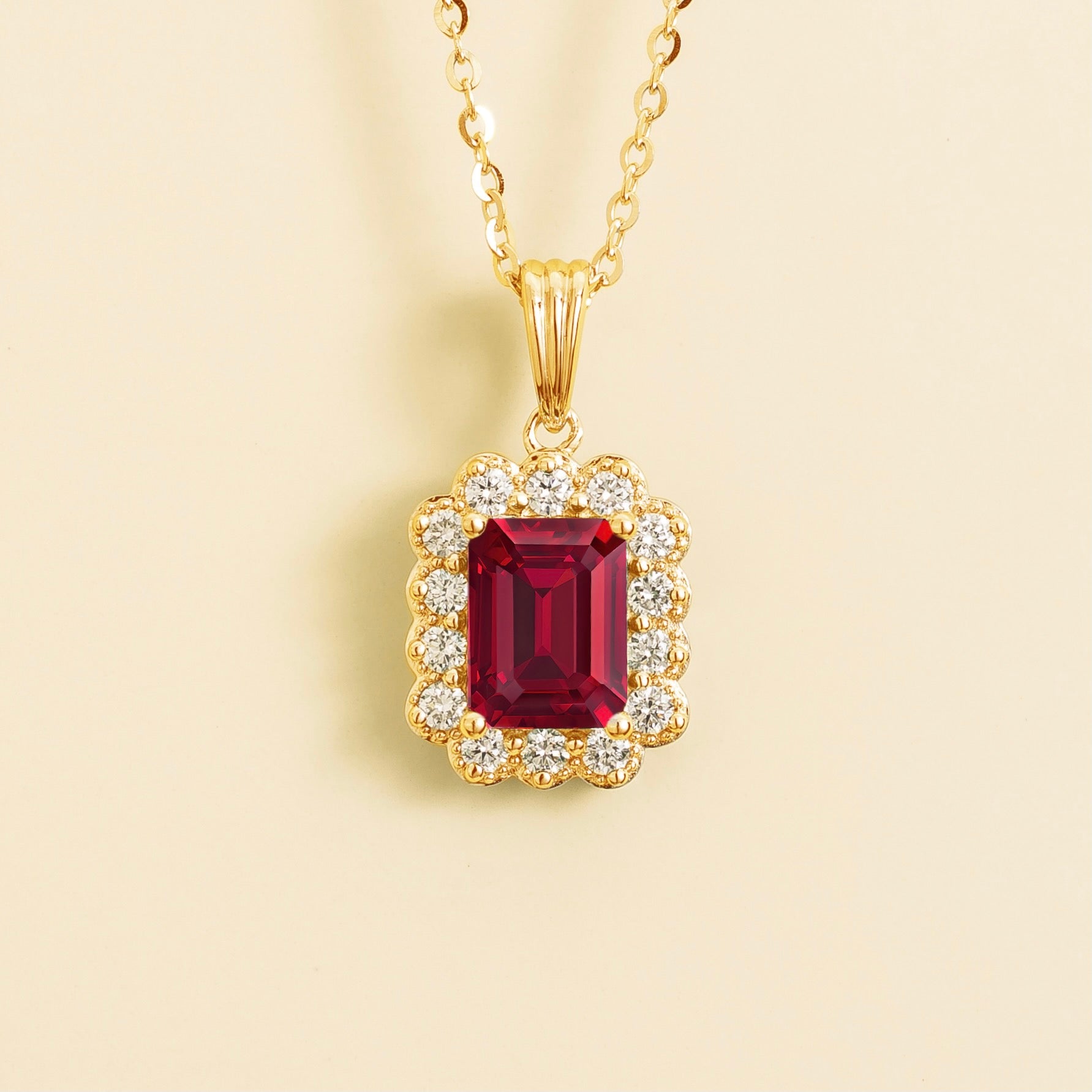 Front view of the Verda Ruby Emerald-Cut & Diamond Halo Pendant Necklace in Gold, handcrafted by Juvetti London