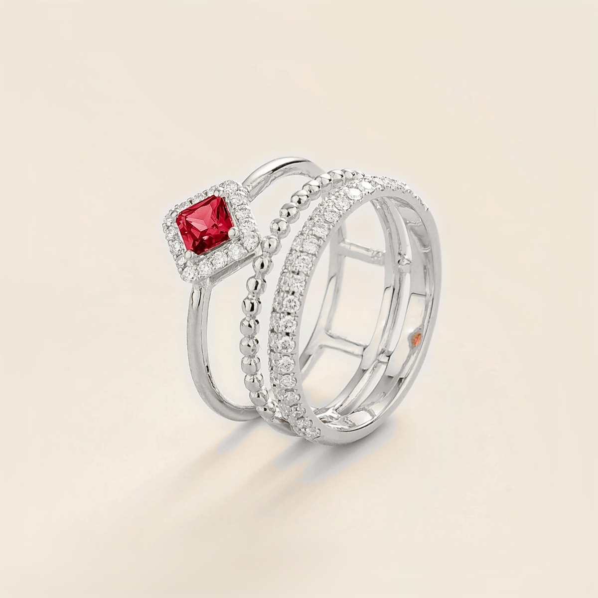 Amici triple-band stacking ring in white gold, princess-cut lab-grown ruby in a diamond halo with beaded and pavé bands, side view | Juvetti London