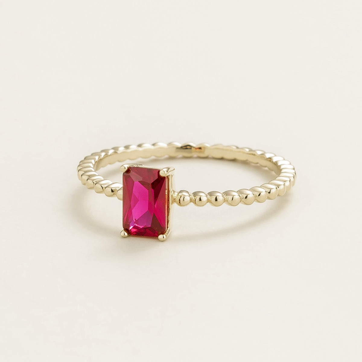 Fondi emerald-cut lab-grown ruby beaded band ring in white gold – angle view | Juvetti London