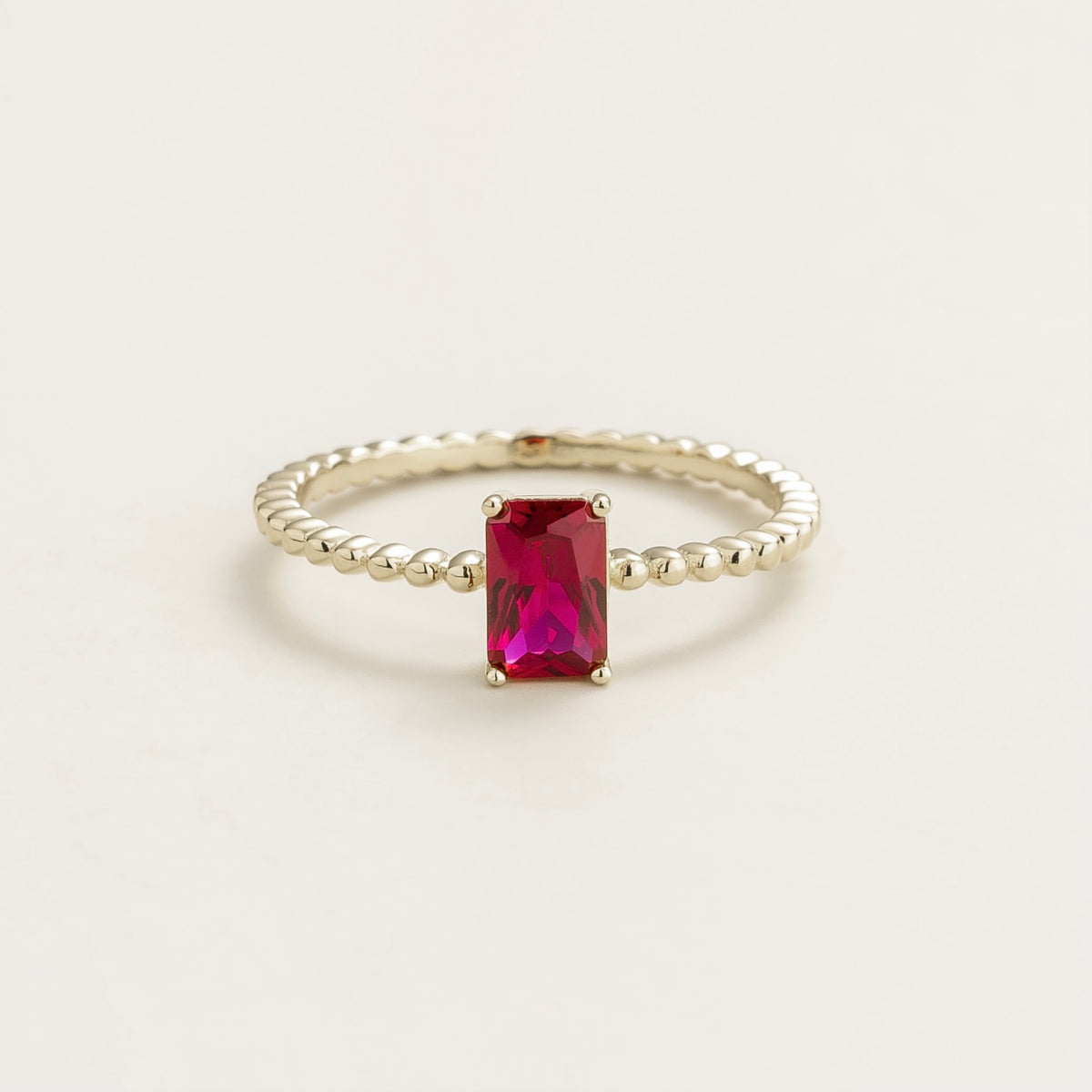 Fondi emerald-cut lab-grown ruby beaded band ring in white gold – front view | Juvetti London