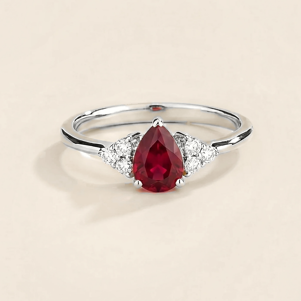 Pear-cut lab-grown ruby and diamond ring in white gold – front view | Pisa by Juvetti
