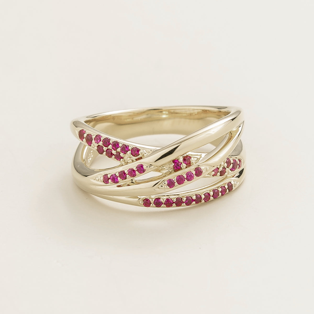 Val multi-row crossover band ring with lab-grown rubies in white gold – front view | Juvetti London