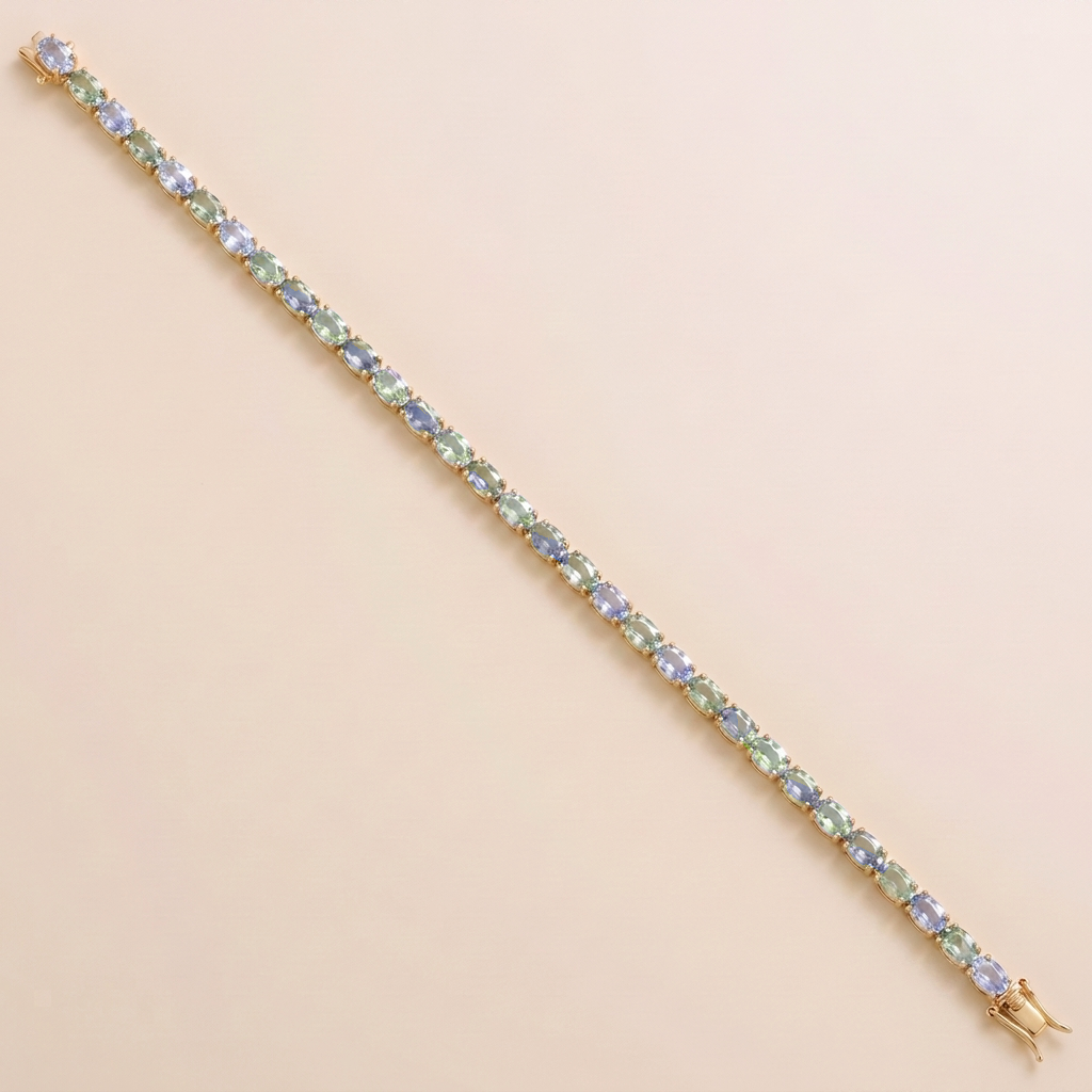 Oval lab-grown pastel blue and green sapphire tennis bracelet in gold | Juvetti London.