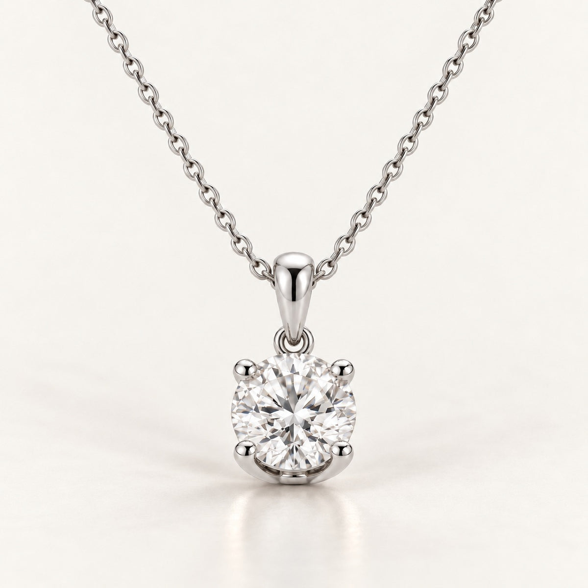 Solitaire pendant setting in white gold or platinum, shown with a 1 ct round diamond