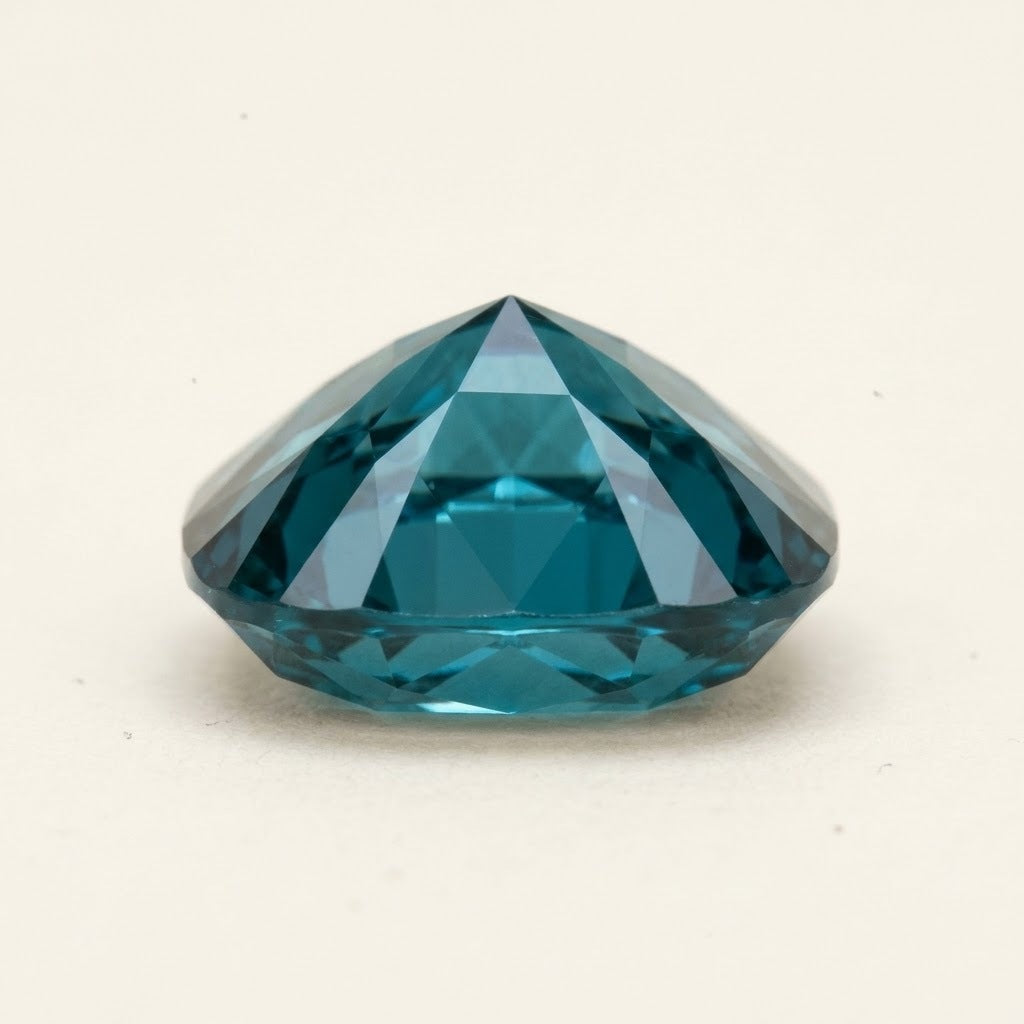 Teal lab-grown sapphire, cushion cut, side view