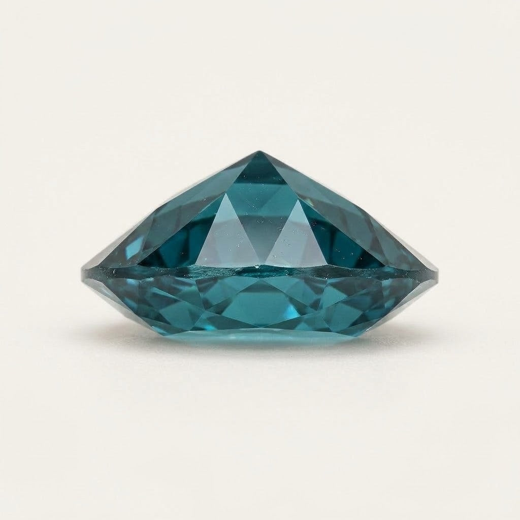 Teal lab-grown sapphire, oval cut, side view