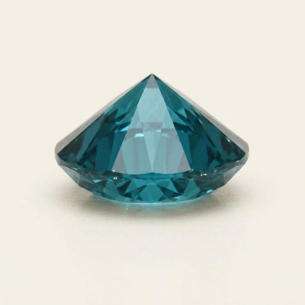 Teal lab-grown sapphire, round cut, side view
