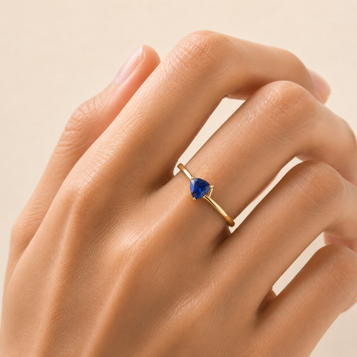 Trillion Blue Sapphire Solitaire Ring in Gold