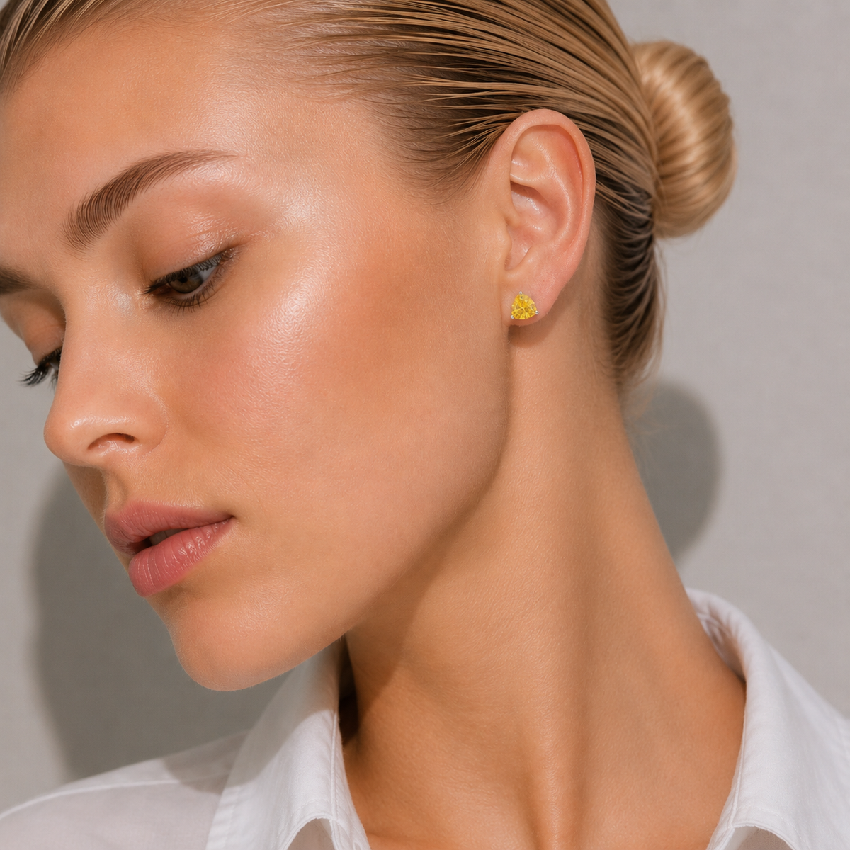 Trillion Yellow Sapphire Solitaire Stud Earrings in White Gold