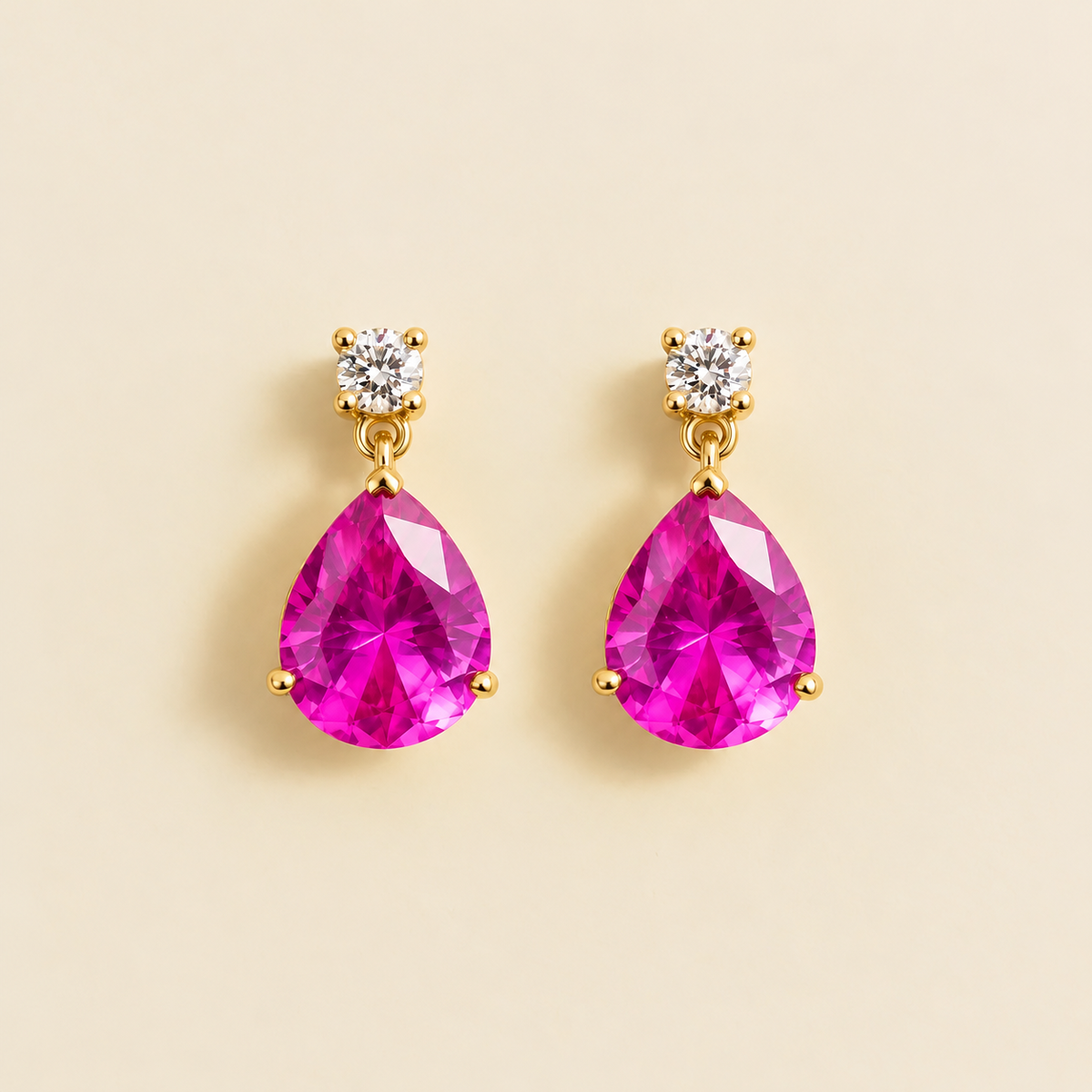 Medium lab-grown vivid pink sapphire and diamond pear drop earrings in gold – front view | Pisa by Juvetti