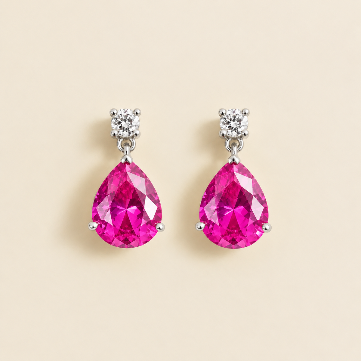 Medium lab-grown vivid pink sapphire and diamond pear drop earrings in white gold – front view | Pisa by Juvetti