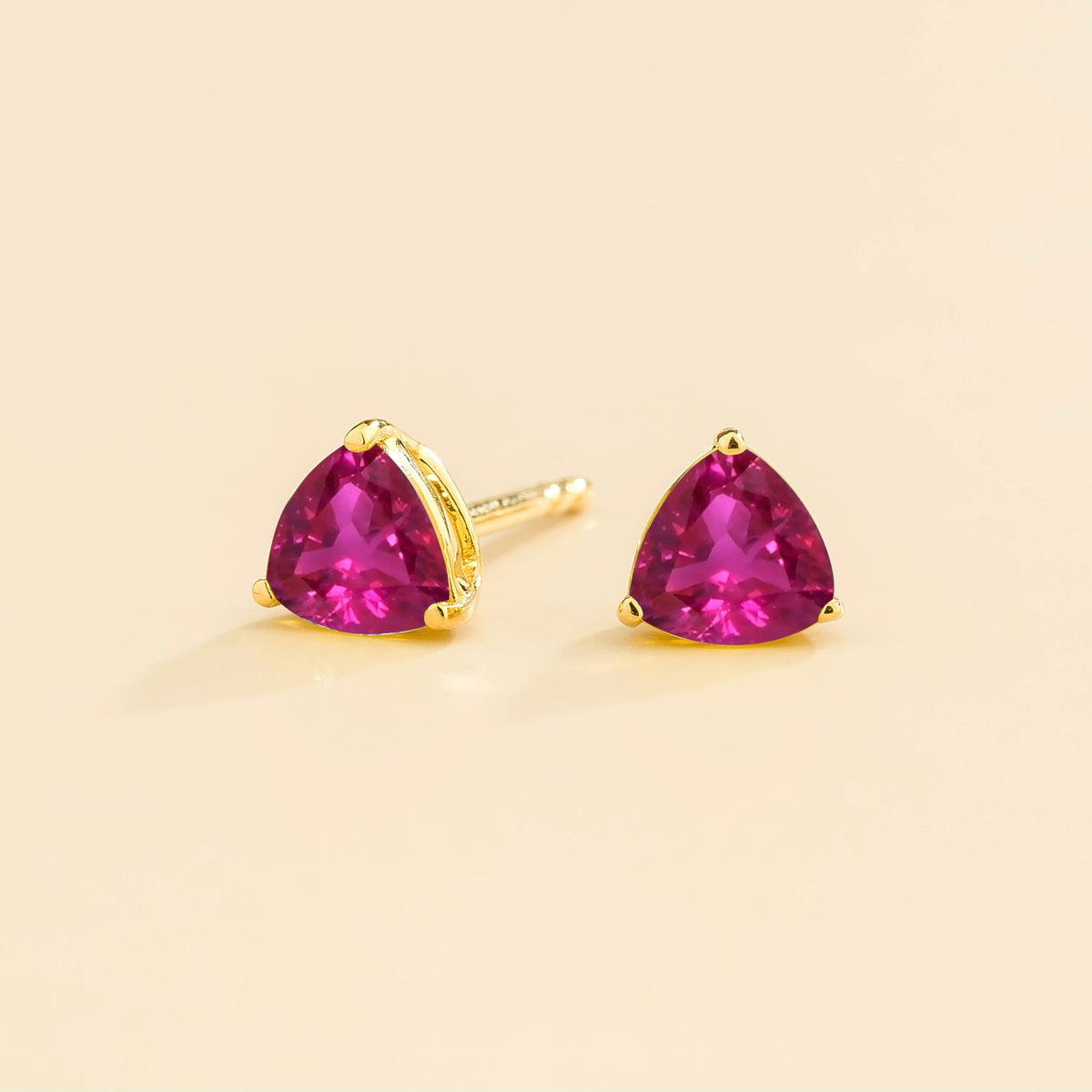 Trillion Vivid Pink Sapphire Solitaire Stud Earrings in Gold – angle view