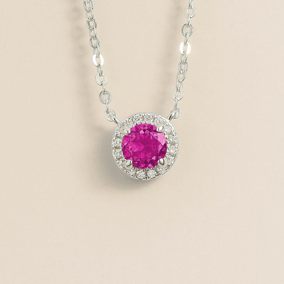 Round lab-grown vivid pink sapphire and diamond halo Mars necklace in white gold | Juvetti London