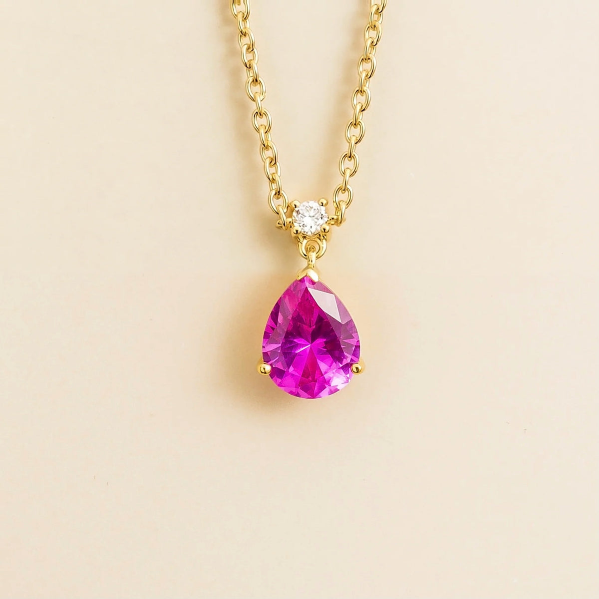 Lab-grown vivid pink sapphire and diamond pear drop pendant necklace in gold, medium – front view | Pisa by Juvetti
