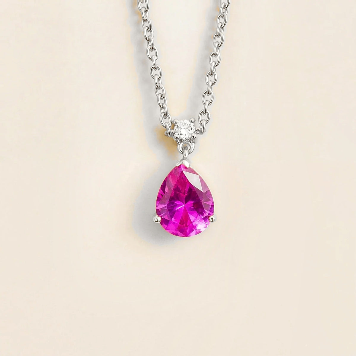 Lab-grown vivid pink sapphire and diamond pear drop pendant necklace in white gold, medium – front view | Pisa by Juvetti