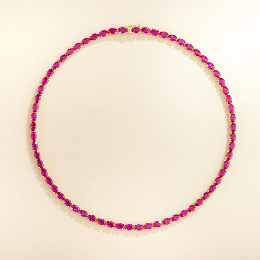 Salto vivid pink sapphire oval tennis necklace in gold