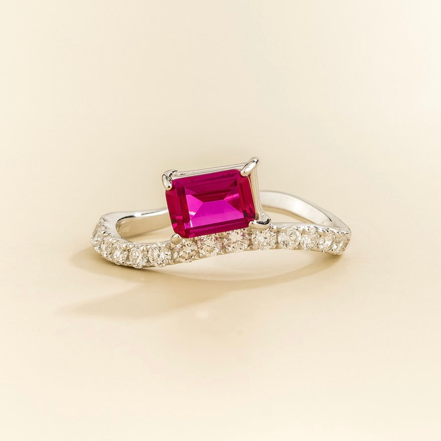 Luno vivid pink sapphire emerald-cut ring with diamond pavé in white gold, lab-grown sapphire set east-west, front view | Juvetti London