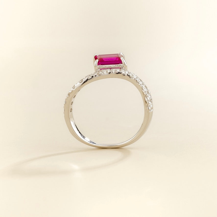 Luno vivid pink sapphire emerald-cut ring with diamond pavé in white gold, lab-grown sapphire set east-west, profile view | Juvetti London