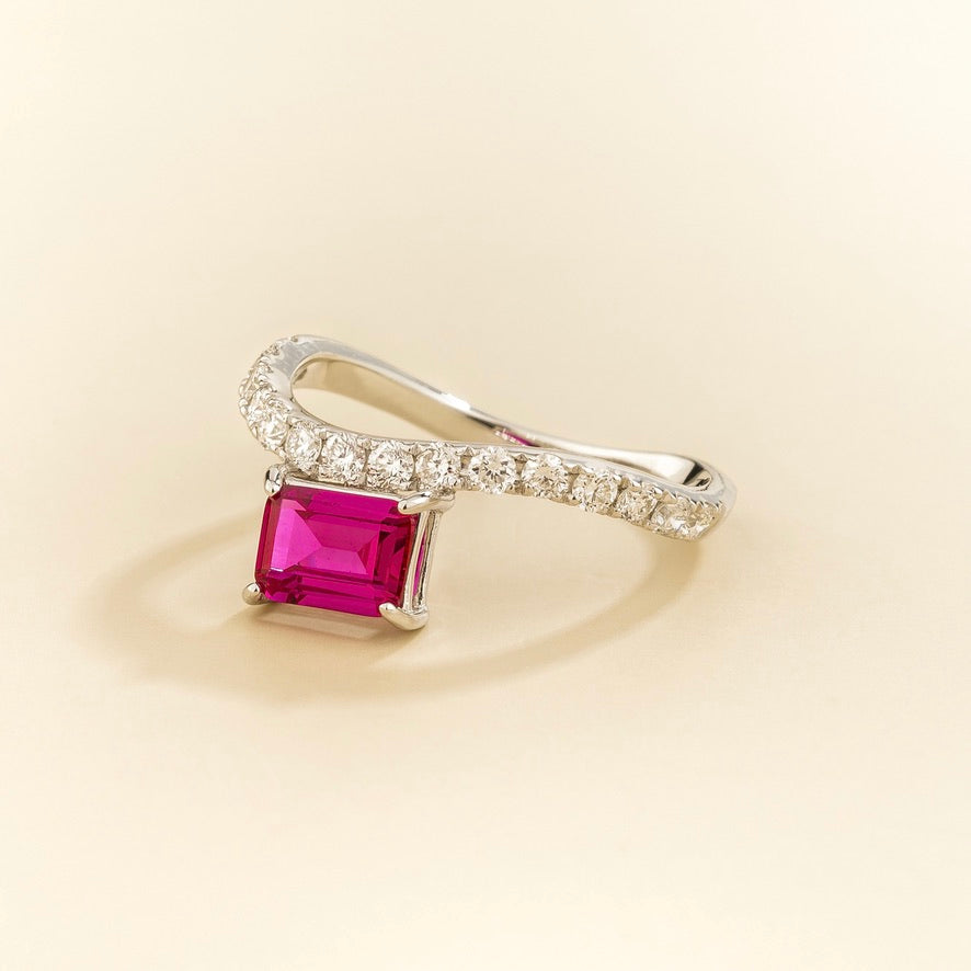 Luno vivid pink sapphire emerald-cut ring with diamond pavé in white gold, lab-grown sapphire set east-west, top view | Juvetti London