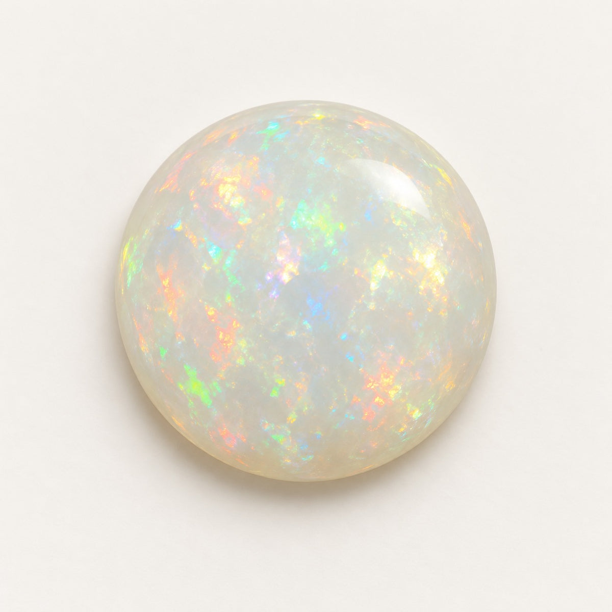 White lab-grown opal, round cabochon