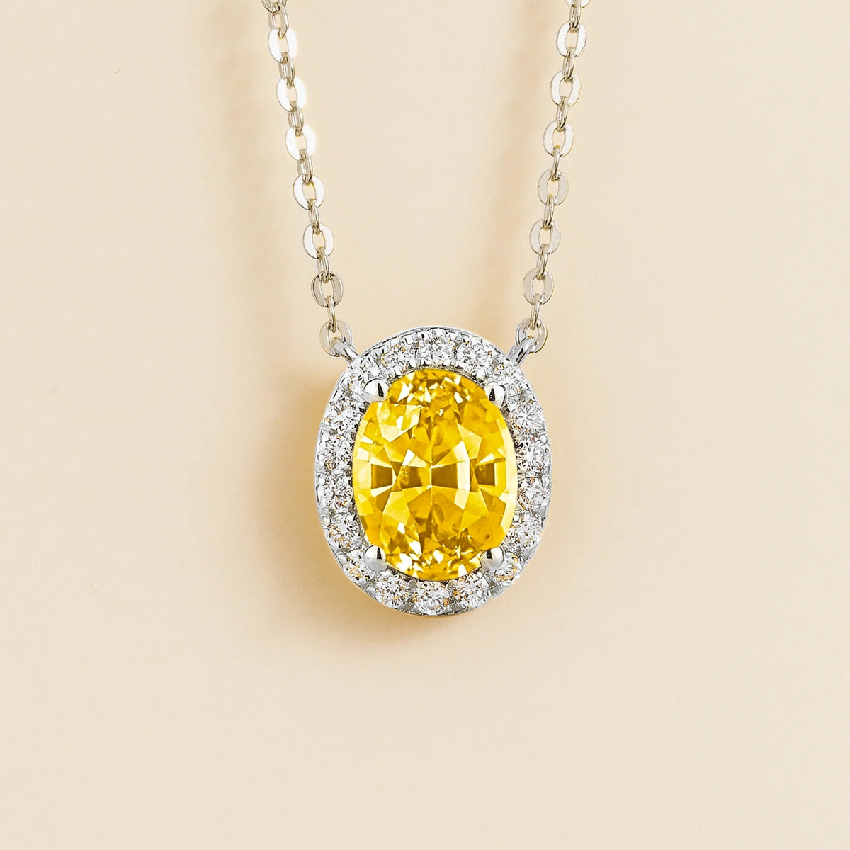 Lab-grown yellow sapphire and diamond oval halo necklace in white gold – front view | Mina by Juvetti