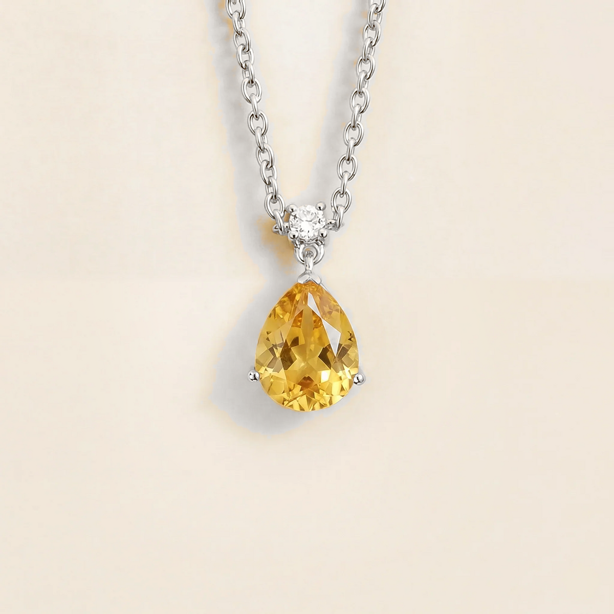Lab-grown yellow sapphire and diamond pear drop pendant necklace in white gold, medium – front view | Pisa by Juvetti
